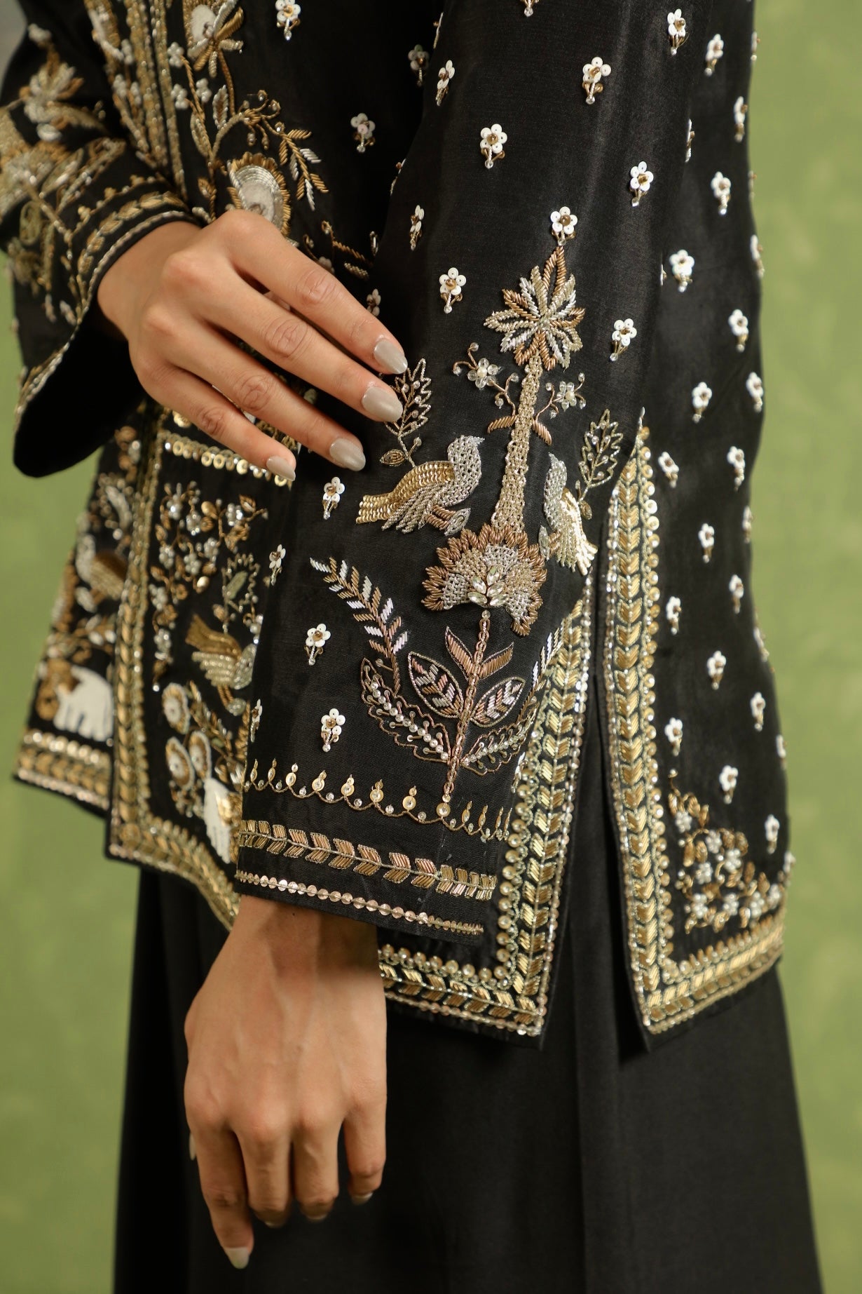 Handworked bird motive on black jacket